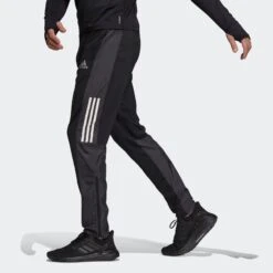 ADIDAS Men's Own The Run Astro Pant - Black 12 ADIDAS Men's Own The Run Astro Pant - Black -Optimal Sportswear Store Own The Run Astro Pants Black GT8937 22 model