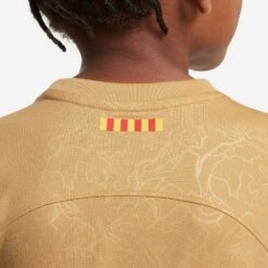 Youth Nike FC Barcelona 2022/23 Away Jersey - Club Gold/Obsidian -Optimal Sportswear Store fc barcelona 2022 23 away little kids soccer kit PBZSkQ 1